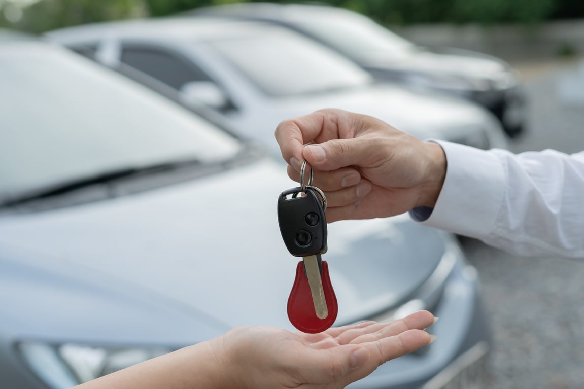 lease, rental car, sell, buy. Dealership manager send car keys to the new owner.  Sales, loan credit financial, rent vehicle, insurance,  renting, Seller, dealer, installment, car care business